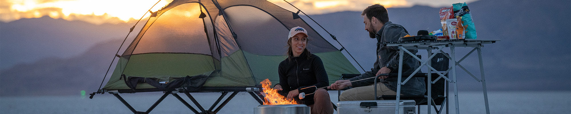 A couple camps on the Utah salt flats with their TETON Sports Vista Tent Bundle.