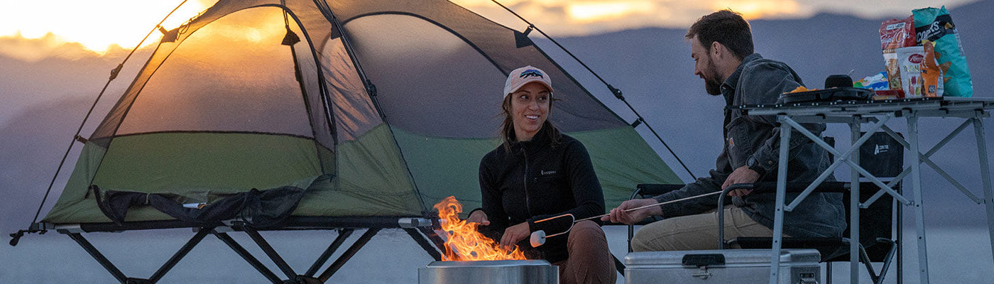 A couple camps on the Utah salt flats with their TETON Sports Vista Tent Bundle.